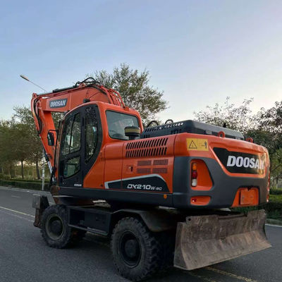 Χρησιμοποιούμενος εξορυκτής τροχών Doosan DX210W υδραυλικός μικρός μεταχειρισμένος εξορυκτής 20100 kg